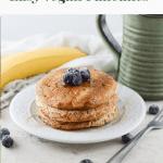 Vegan whole wheat pancakes stacked on a white plate