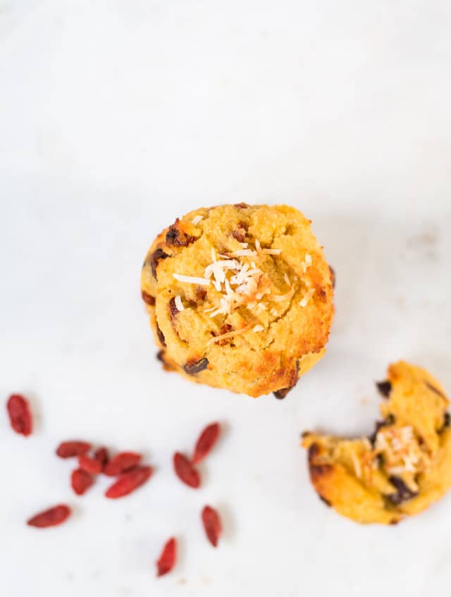 overhead shot of coconut flour cookies with goji berries sprinkled around