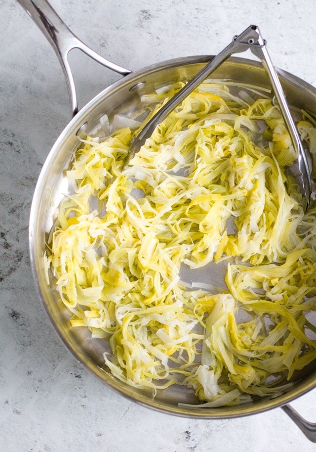 Cooked leek noodles in a saucepan