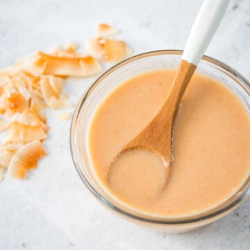 Homemade toasted coconut butter served in a small glass dish