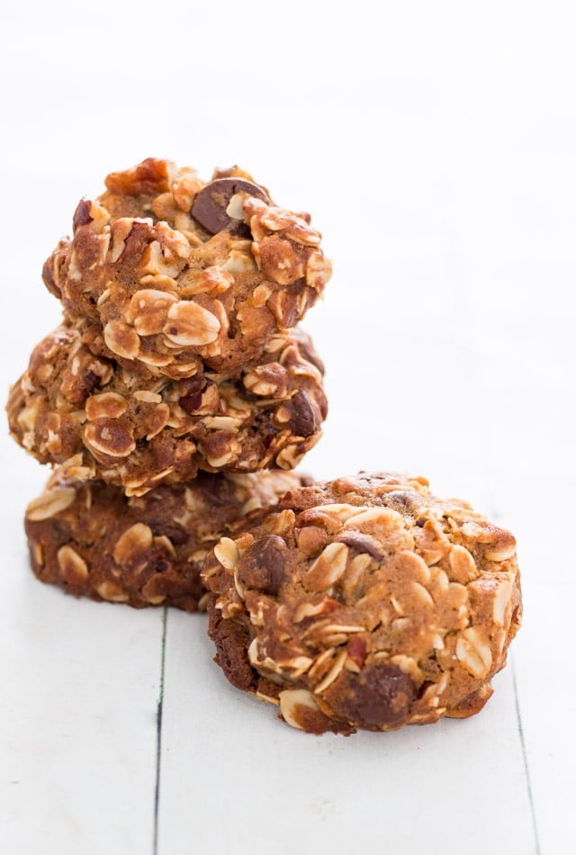 stack of 3 dark chocolate oatmeal cookies against a white background