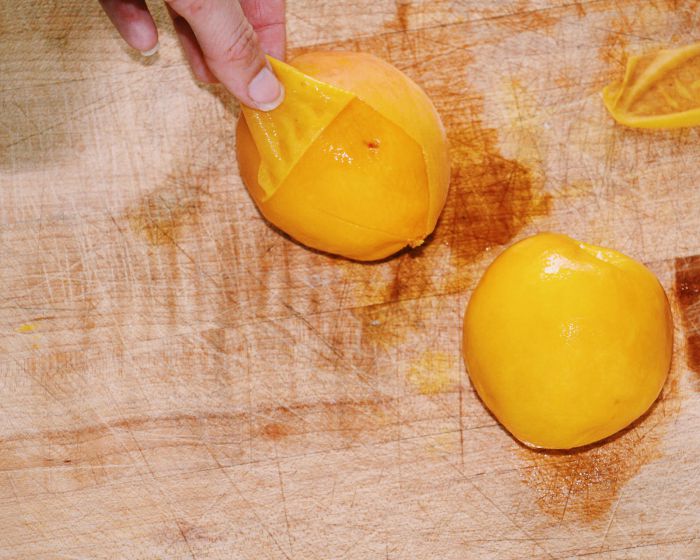 How to Perfectly Peel a Peach: peeling the skin away from the flesh