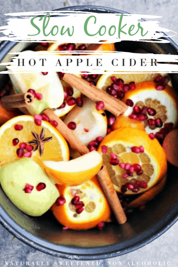 all the ingredients for crockpot apple cider decorated with star anise and cinnamon sticks