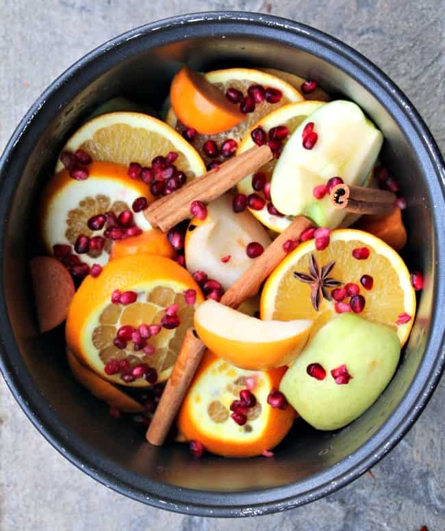 Fall Harvest hot apple Cider ingredients in the bowl of a slow cooker