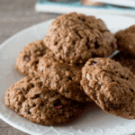 Pomegranate cookies piled onto a white plate