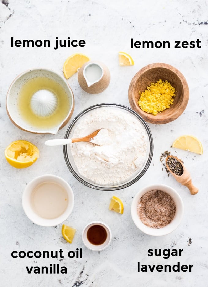 Overhead Ingredient shot for lemon and lavender scones with ingredients surrounded by small lemon wedges