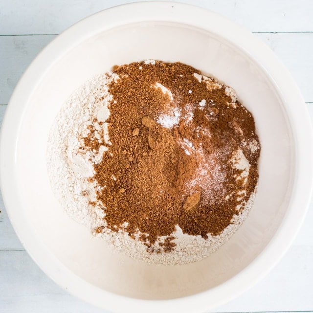 overhead shot of white bowl containing flour, coconut sugar, salt and cinnamon