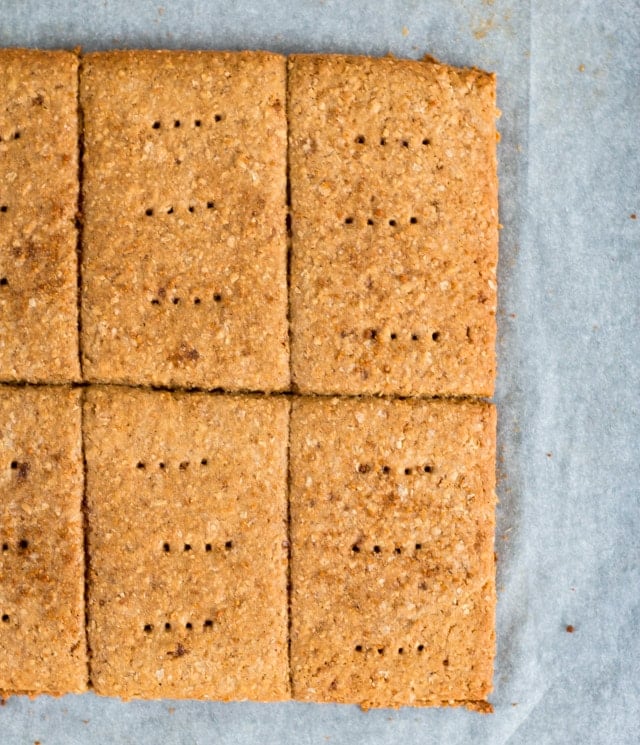 overhead close up shot of 6 vegan graham crackers on parchment paper