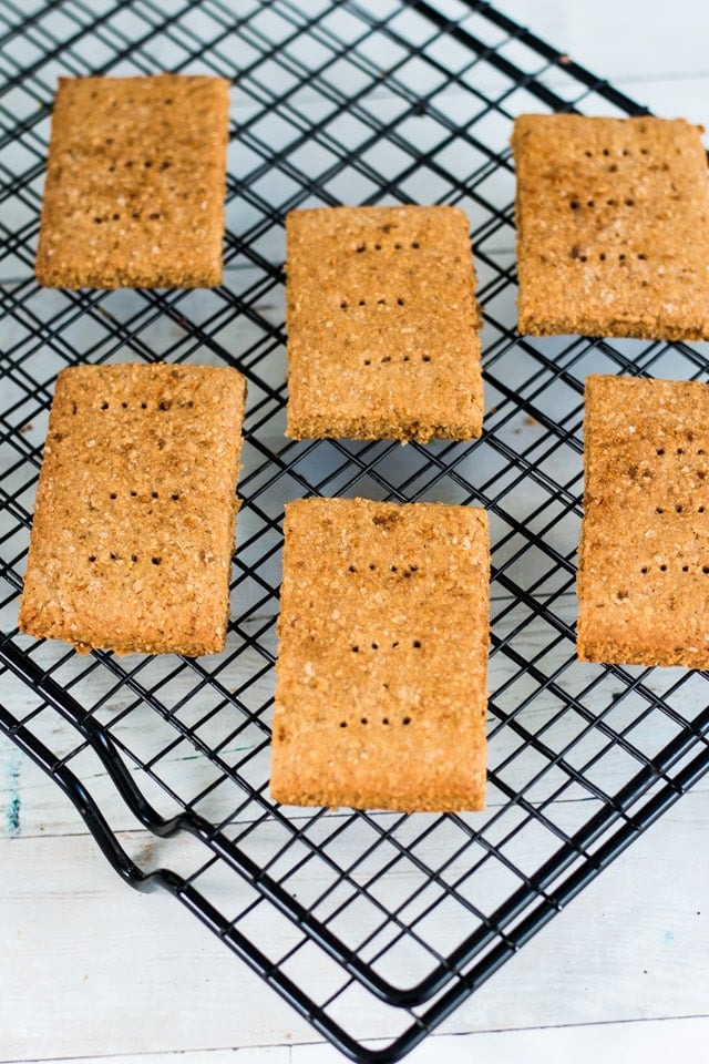 angled shot of graham crackers on a black cooling tray