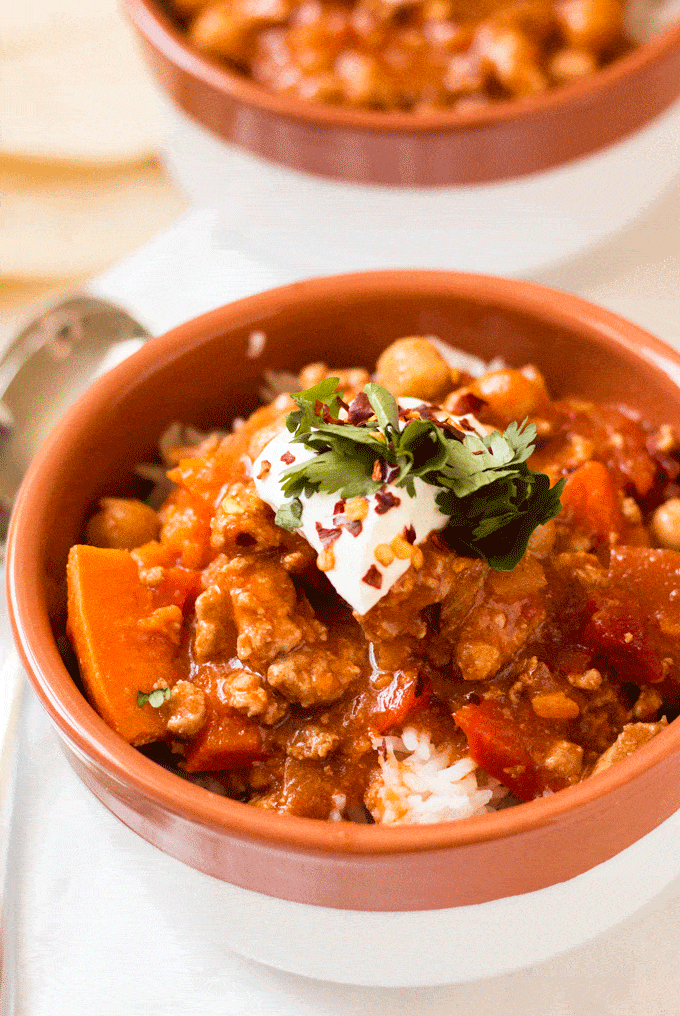 Turkey Chili up close and served in a white and terracotta bowl