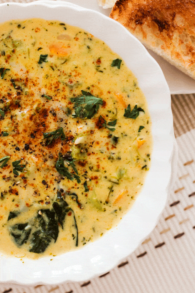 Up close shot of Instant Pot Broccoli Cheese Soup in a white bowl