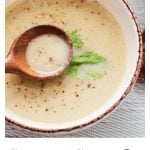 single bowl of cream of celery soup with celery leaf for decoration