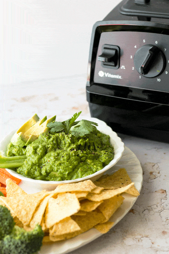 Green pea Guacamole with a vitamix blender in the background