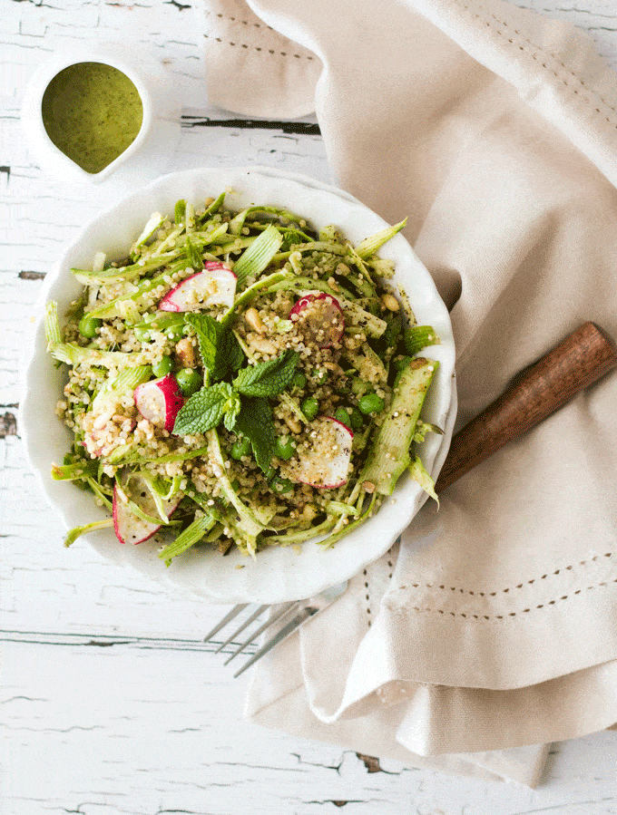 Radish Pea and Quinoa Shaved Asparagus Salad with a linen napkin and a side of dressing 