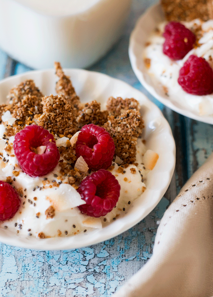 Chia Breakfast Oat Squares in a bowl of yogurt with raspberries 