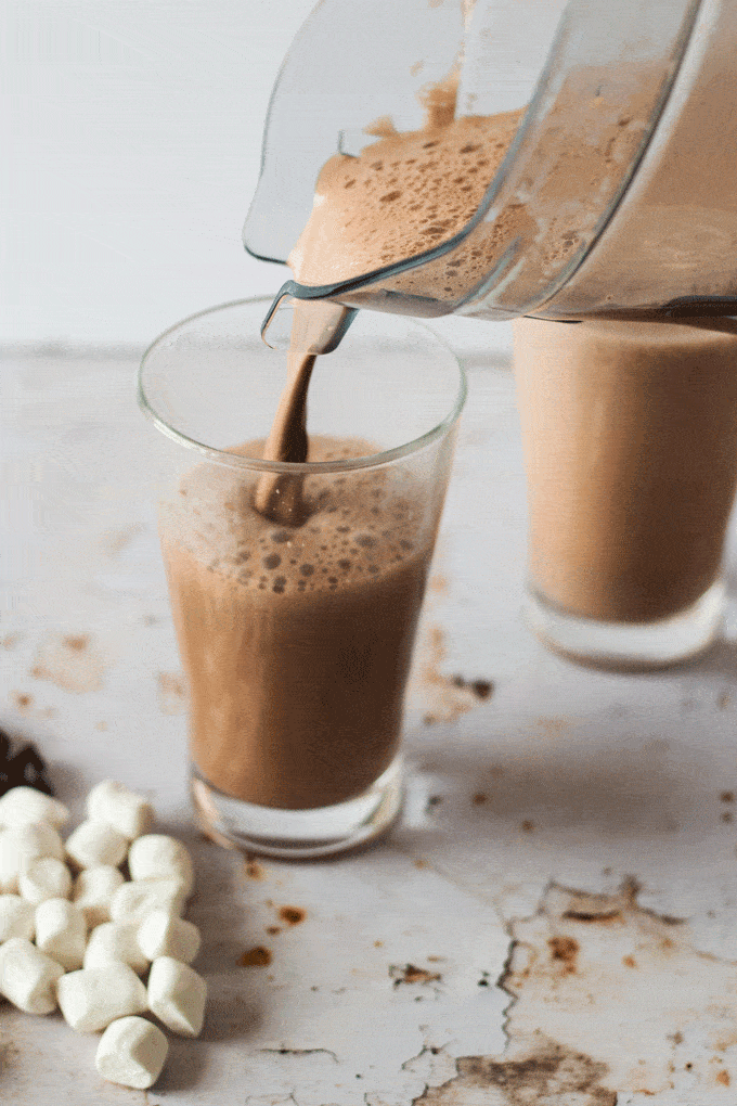 Pouring the The Best dark Hot Chocolate Recipe Using Real Chocolate from the jug into a glass