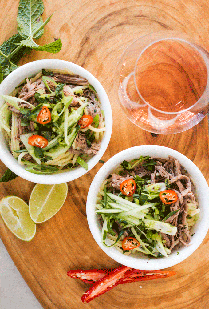 instant pot soup recipes: Beef Brisket Lemongrass Noodle Bowl served in two white bowls on a wooden board