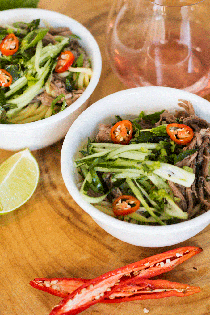 Beef Brisket Lemongrass Noodle Bowl served in white bowls on a wooden background