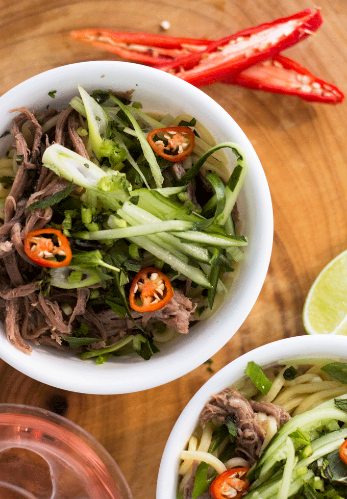 Beef Brisket Lemongrass Noodle Bowl served in a white bowl on a wooden background