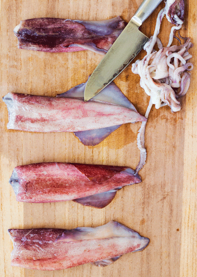 Cutting the squid to prepare it for Salt and Pepper Squid