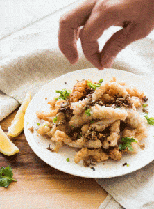 sprinkling some sea salt on top of Salt and Pepper Squid