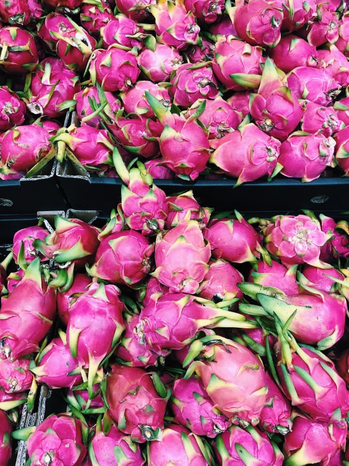 Foodie travel with kids: dragonfruit at the market