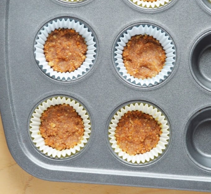 The base for the Pineapple Yogurt Bites pressed into mini muffin pans