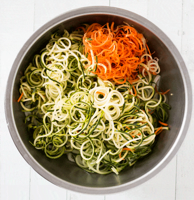 big bowl of spiralized veggies including zucchini and carrots