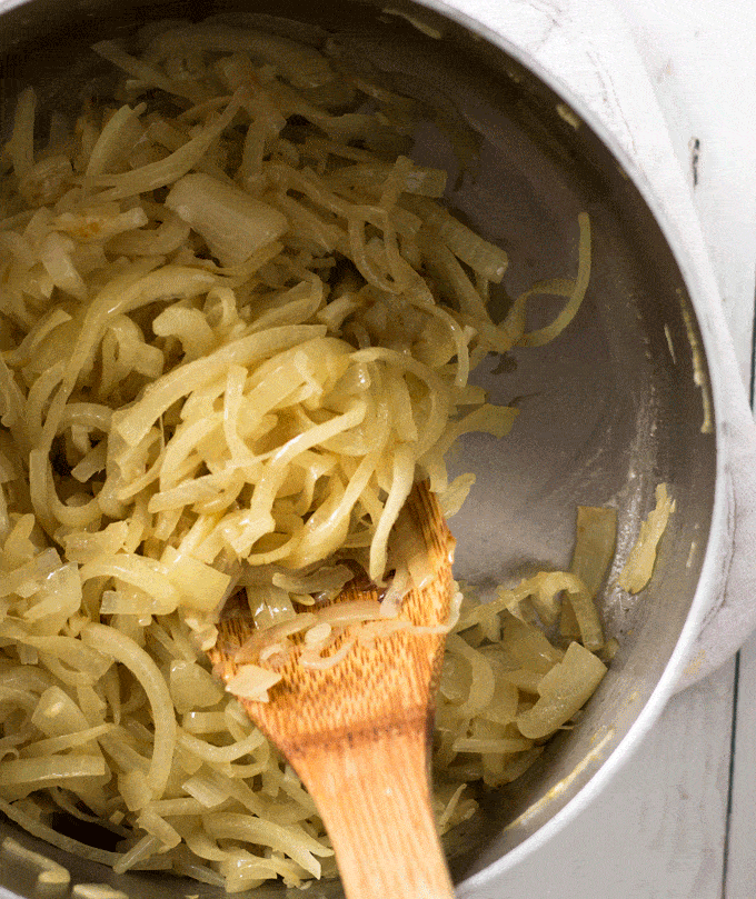 caramelized onions getting darker in a saucepan