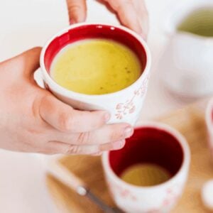 white matcha hot chocolate served in small cups