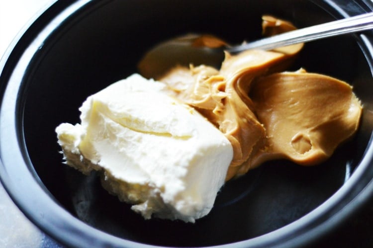 cream cheese and peanut butter being mixed together