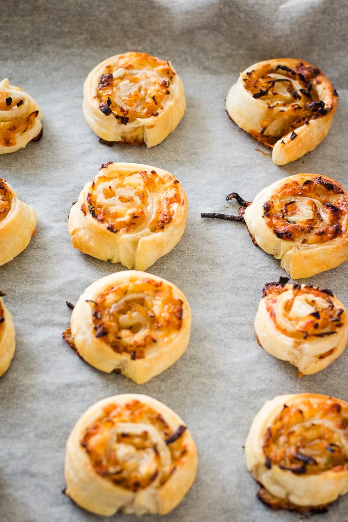 caramelized onion puff pastry appetizer on a baking tray