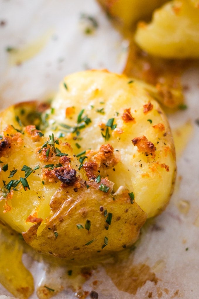 christmas potatoes: up close shot of a smashed and roasted potato