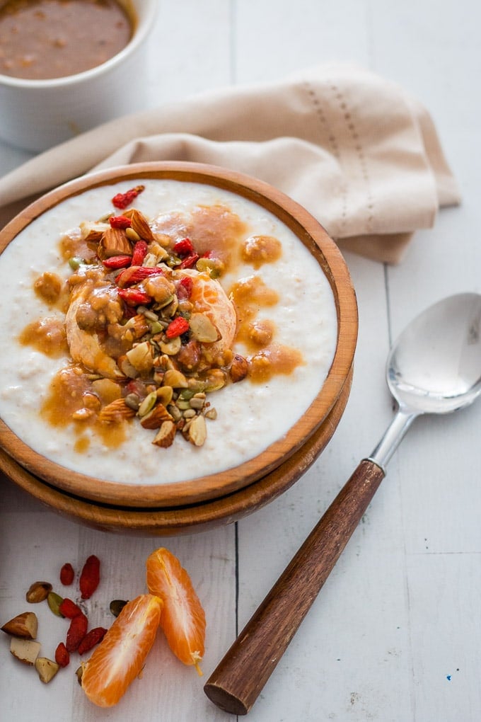 winter porridge served in a wooden bowl and a wooden spoon