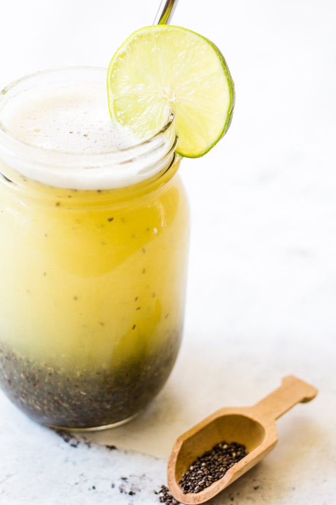 Lime chia fresca in a glass jar with a reusable straw