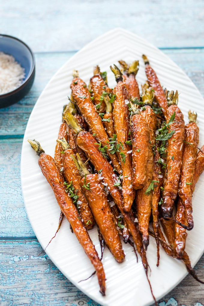 Roasted dutch carrots served on a white platter plate