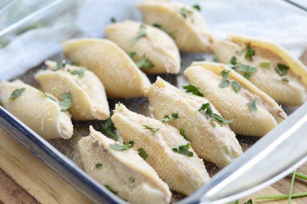 giant pasta shells stuffed with a tuna mixture and baked in a glass dish