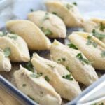 giant pasta shells stuffed with a tuna mixture and baked in a glass dish