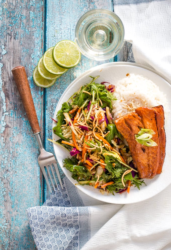 easy teriyaki salmon on a white plate with slaw