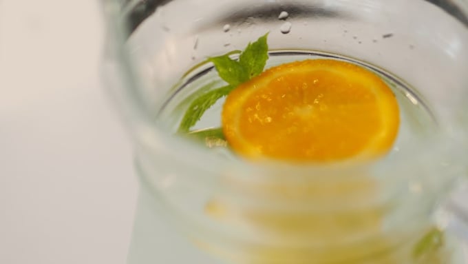 orange and mint in a large pitcher of water to make orange and mint infused water