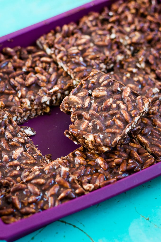 square of healthy rice bubble treat  cut out from the rest of the slice and sitting on top