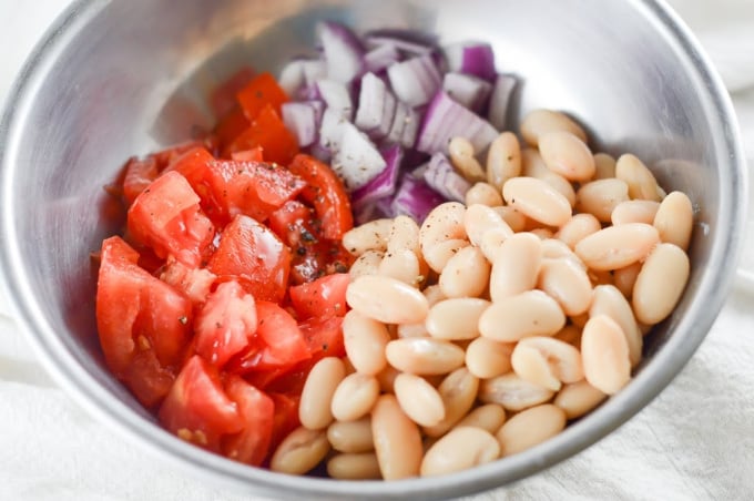 Add all the ingredients for avocado white bean salad to a bowl