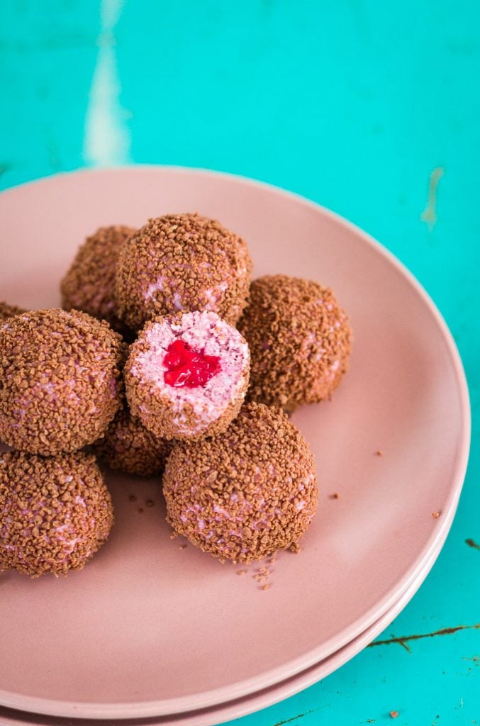 Gooey insides of a chocolate covered strawberry cheesecake bliss ball