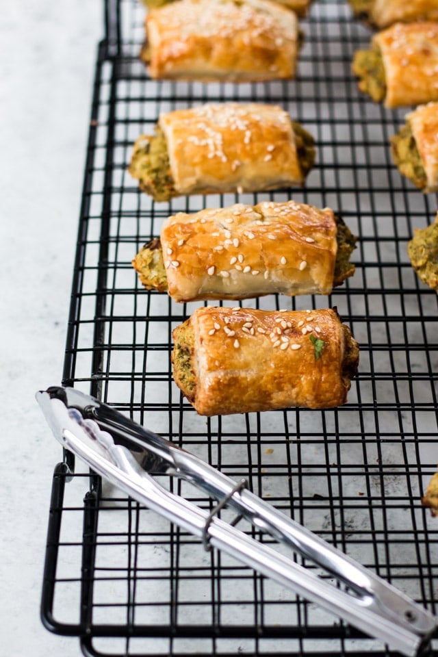 baking tray with lots of vegan sausage rolls cooling