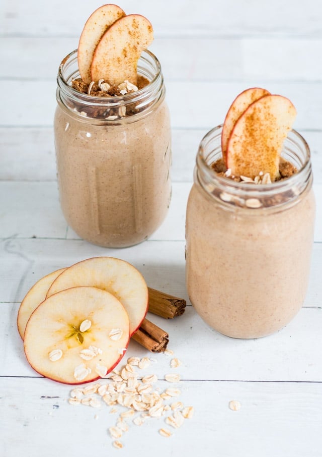 2 apple pie smoothies in glass mason jars against a white background