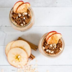 2 apple pie smoothie in glass mason jars against a white background