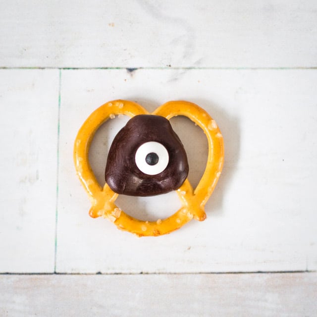 small pretzel chip with a chocolate circle and an edible eyeball