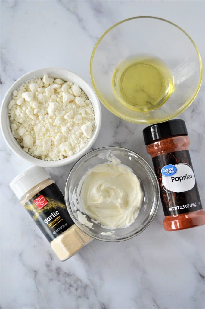 Ingredient shot for whipped feta: crumbled feta, cream cheese, olive oil, garlic powder and paprika