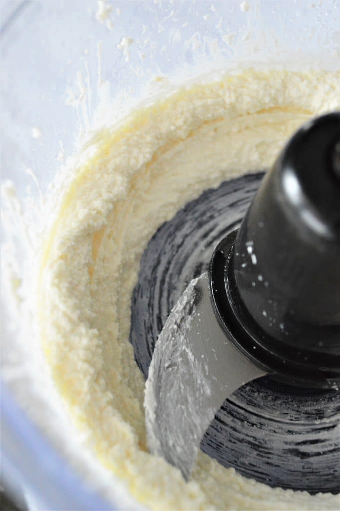 Whipped feta in the bowl of a food processor