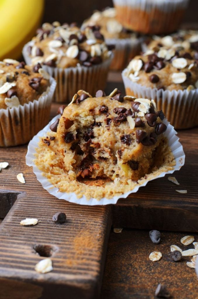 Up close shot of a Peanut butter chocolate chip banana oatmeal muffin with a bite taken out of it